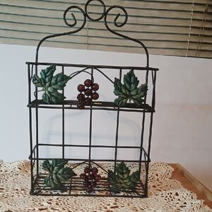 Source Unknown Black and Green Display Shelves with Nature-Inspired Design